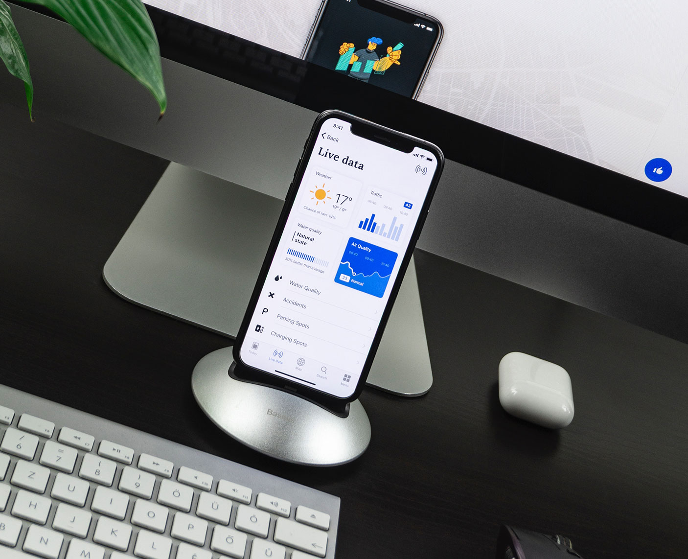 Phone in Docking Station with Keyboard and Monitor Displaying mobile friendly website on mobile phone
